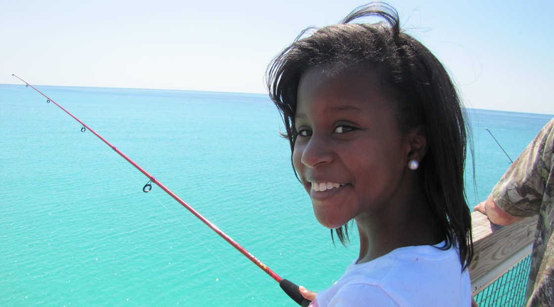 Fishing associations engage youth in recreational fishing, building a coalition for conservation that will continue to work for sustainable fisheries and habitats long into the future. Photo credit: IGFA girl, fishing, dock