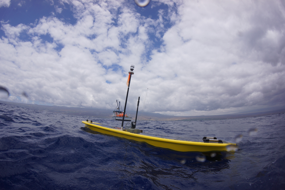 Liquid Robotics used the beautiful waters off the Hawaiian Islands to test the robot. From above the water, you can only see the surface float, which houses electronics that are supplied power by the solar panels. Photo credit: Liquid Robotics Liquid Robotics, Seagoing Robot, Wave Glider, Water Robot, Ocean Robot, Fishery Monitoring