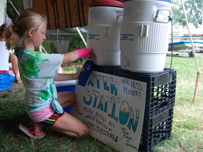 Child refilling with water cooler
