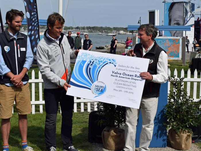 Tyson Bottenus awards the Platinum Level Clean Regattas Certification to the Knut Frostad, CEO of the Volvo Ocean Race and Brad Read, Executive Director of Sail Newport.