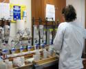 Dr. Emily R. Hall of Mote Marine Laboratory prepares to filter water samples for ECOHAB research. Photo credit: Mote Marine Laboratory Mote Marine Laboratory, Dr. Emily R. Hall, filter water samples