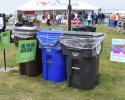 At every location where trash is collected, a trash can, a recycling bin and a composting bin are setup together. Clear signage on top the cans help visitors sort their trash. 