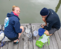 Our Education Director, Shelley Brown, showing Atlantic Cup's Race Director, Hugh Piggin, what she collected in the plankton net. Photo credit to Billy Black. plankton, microbes, net