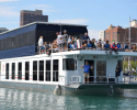 Spectators and competitors used a rotation barge that included heads (toilets) and holding tanks, eliminating the need to discharge waste into the lake. rotation barge, sailors, clean regattas, no discharge
