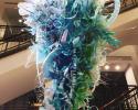 Updrop, by Aurora Robson, was suspended over the bar for a dramatic entranceway. While it may look like blown glass, the artwork is actually made out of trash. ocean trash sculpture, trash sculpture, Aurora Robson, marine trash plastic sculpture,